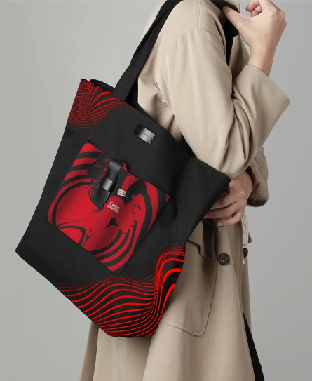 Black tote bag with a red Coca-Cola graphic print